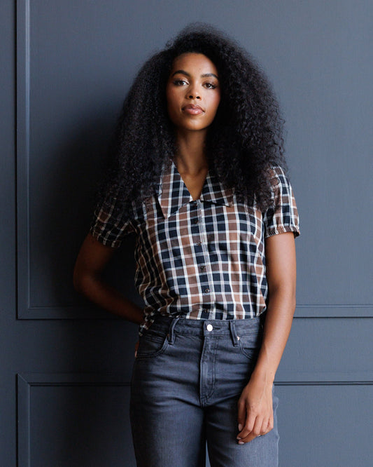 Downeast classic plaid button-down top with long sleeves, featuring a traditional checkered pattern in blue, red, and white.