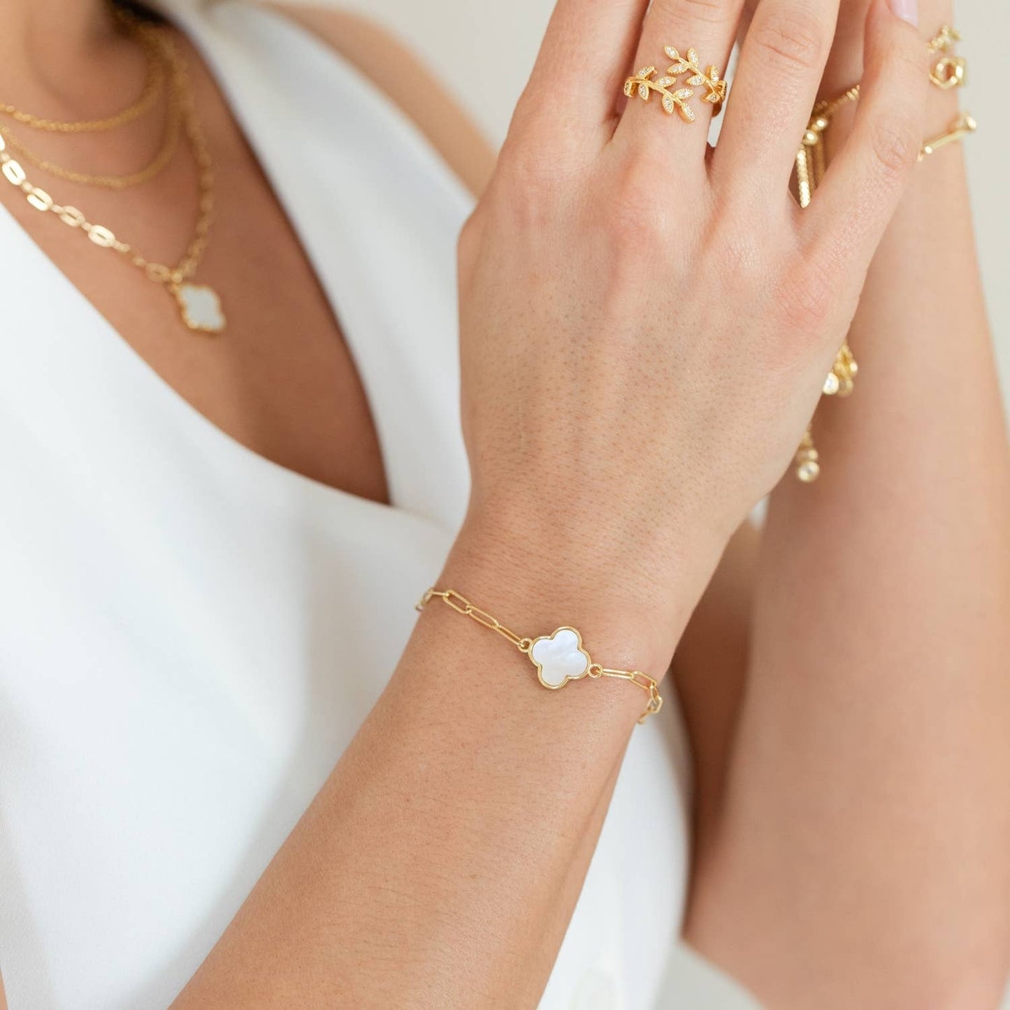 Gold Quatrefoil Pulley Bracelet by Splendid Iris featuring intricate quatrefoil design and adjustable pulley clasp.