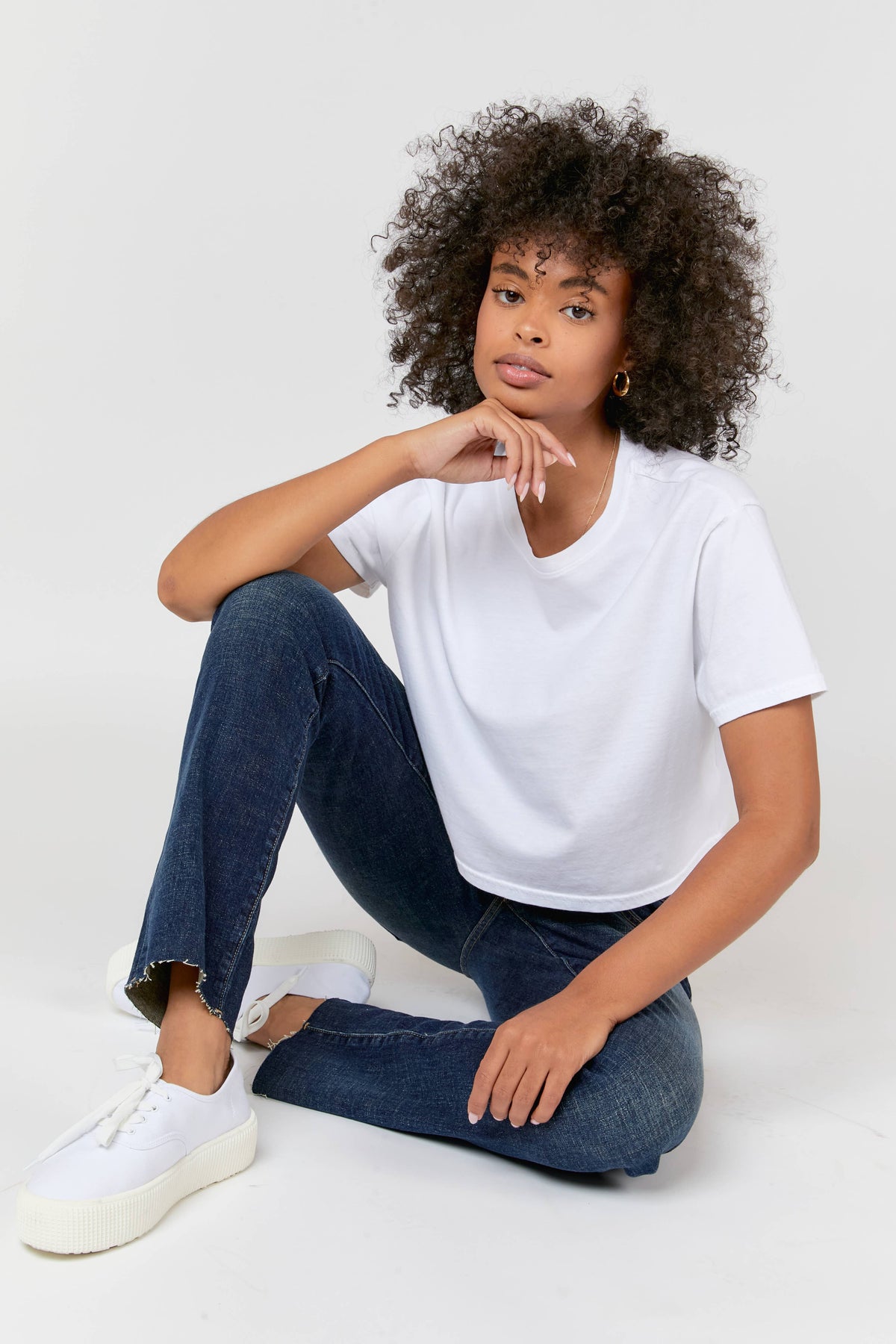 Oliver Logan Crosby Mid Rise Relaxed Taper Jean in standard wash, showcasing casual denim bottoms with a relaxed fit and tapered leg.