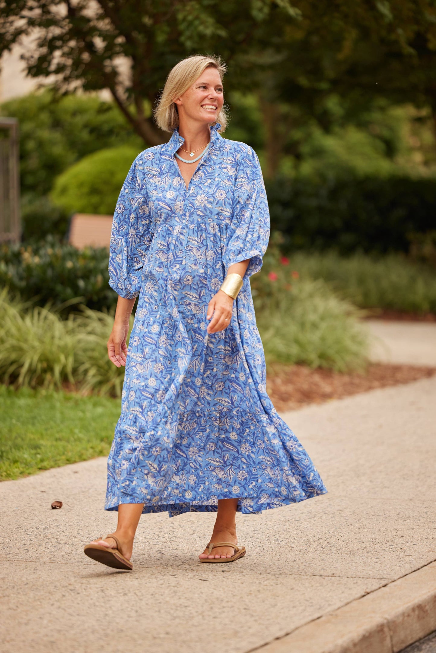 The Hydrangea Palmetto Dress from The Monogram Corner, a stylish floral dress with a flowing silhouette and vibrant hydrangea pattern.
