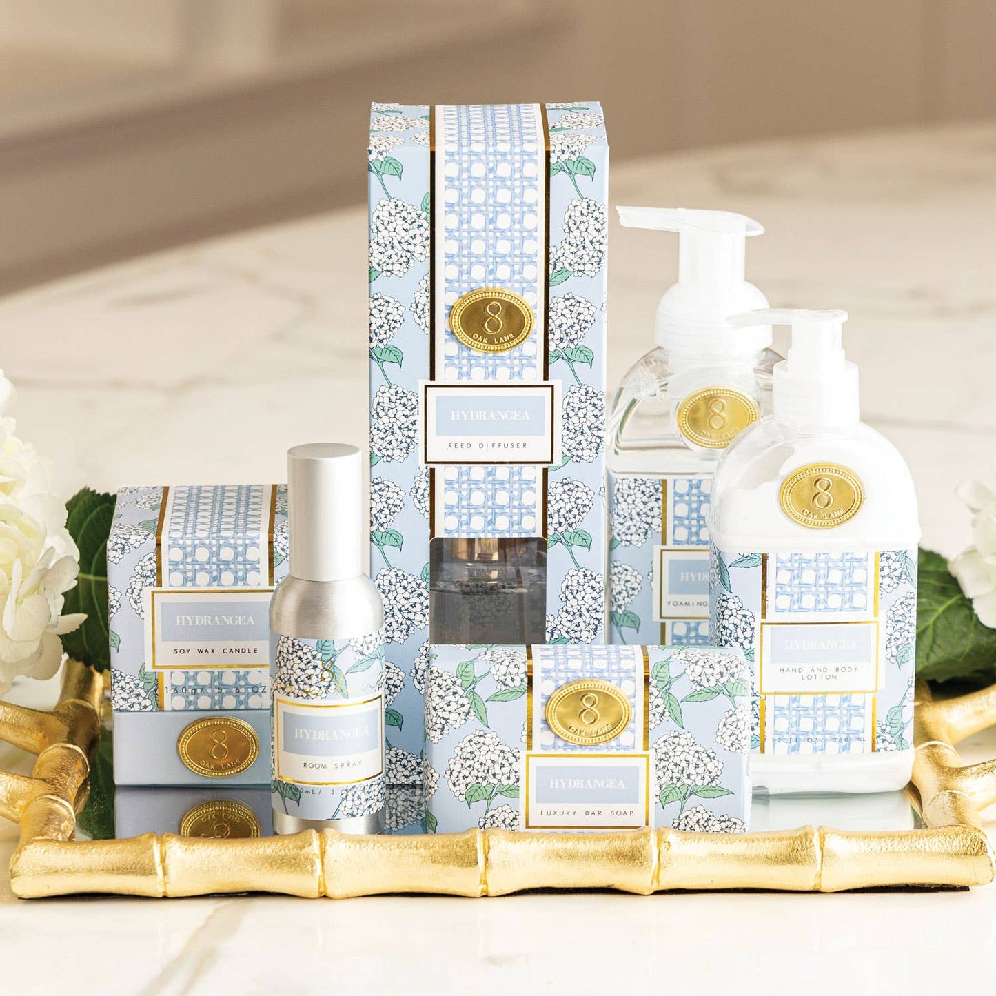 The Lillian Hydrangea Candle by 8 Oak Lane featuring a decorative candle with a hydrangea floral design.