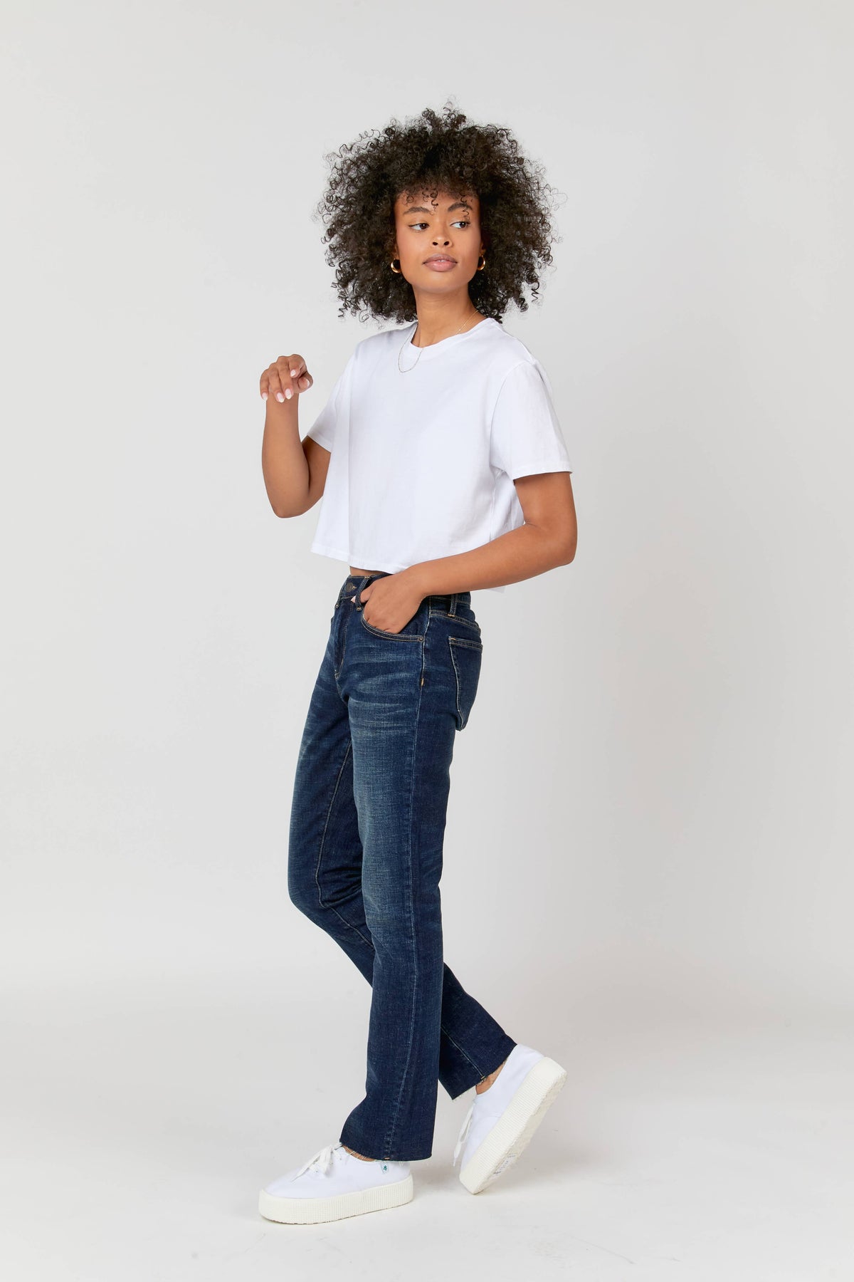 Oliver Logan Crosby Mid Rise Relaxed Taper Jean in standard wash, showing the fit and style of the casual denim bottoms.
