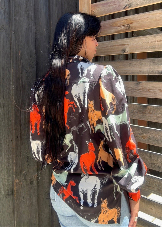 Black "Off To The Races" horse print blouse by Lil Bee's Bohemian, featuring a stylish horse racing design.