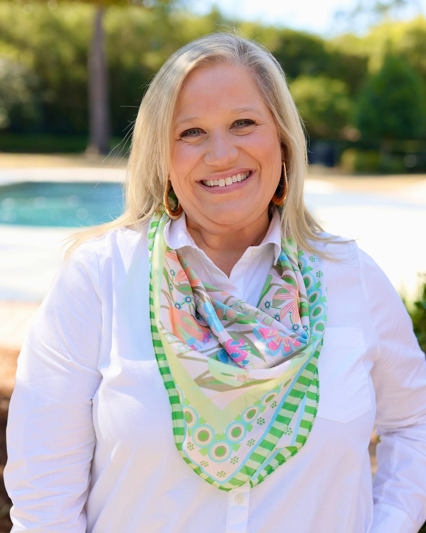 Caroline Hill Brady floral silk-feel scarf in garden green with vibrant floral pattern, lightweight and stylish accessory.