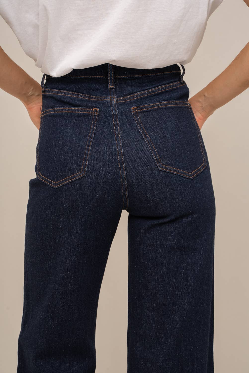 Pair of Oraije Paris Gabriel Wide Jeans with a relaxed fit, showcasing the dark denim fabric and wide-leg style.