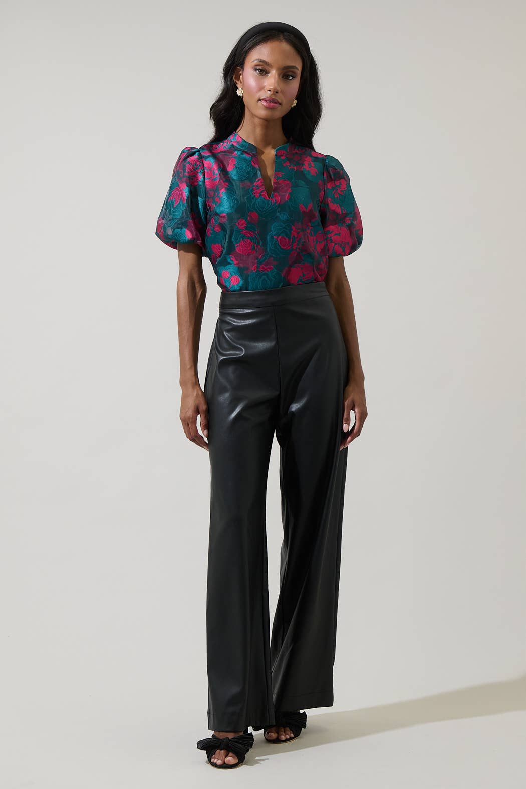 Sugarlips Anisa Leather Bern Wide-Leg Pants in black, featuring a high-rise fit and wide-leg design, shown on a model.
