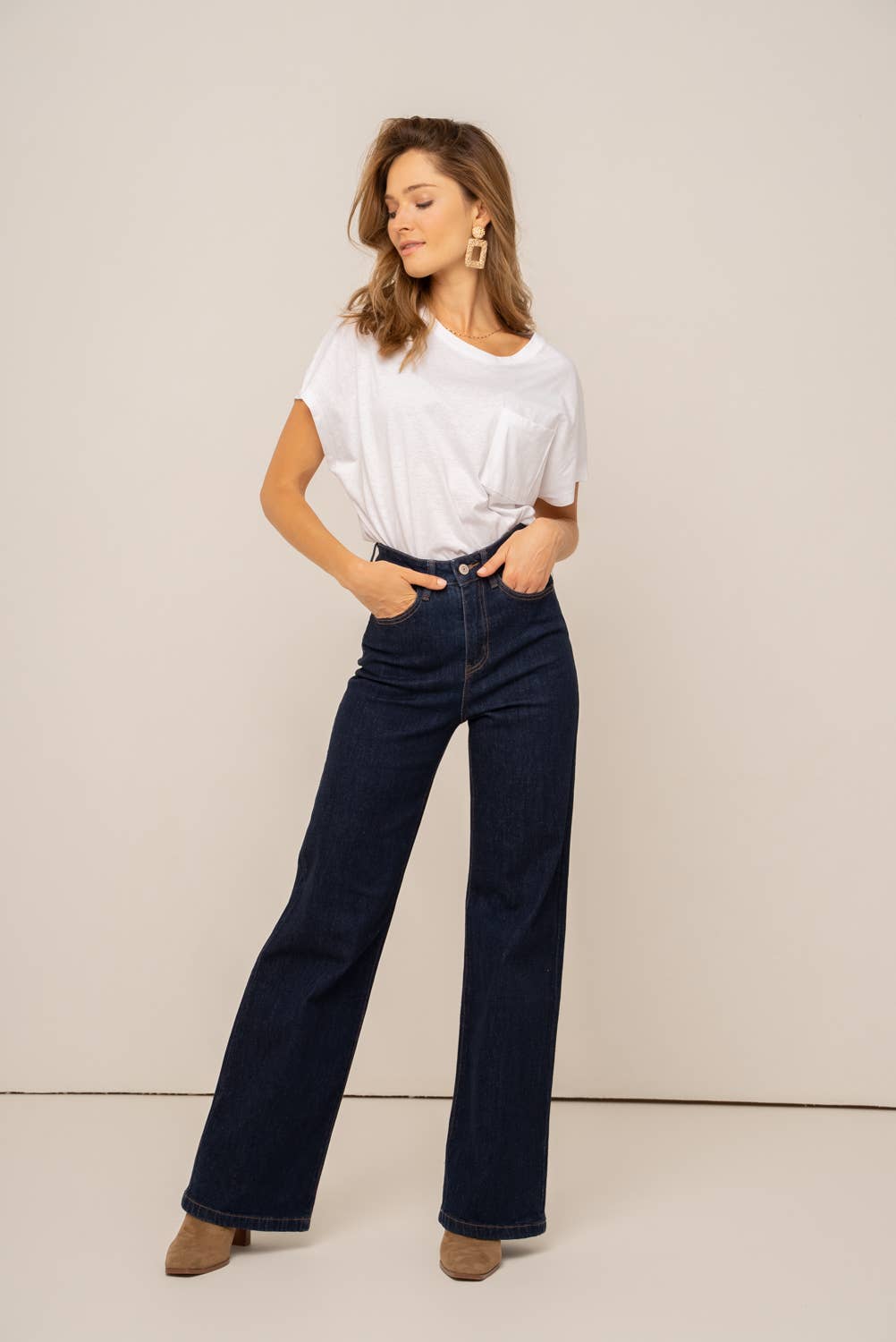 Oraije Paris Gabriel Wide Jeans, stylish blue bottoms with a relaxed fit, shown on a model in this fashion product image.