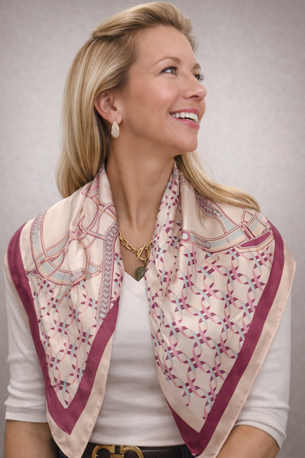 Silk square scarf with colorful Riviera print by UZ Wholesale Store, featuring elegant floral and geometric patterns.