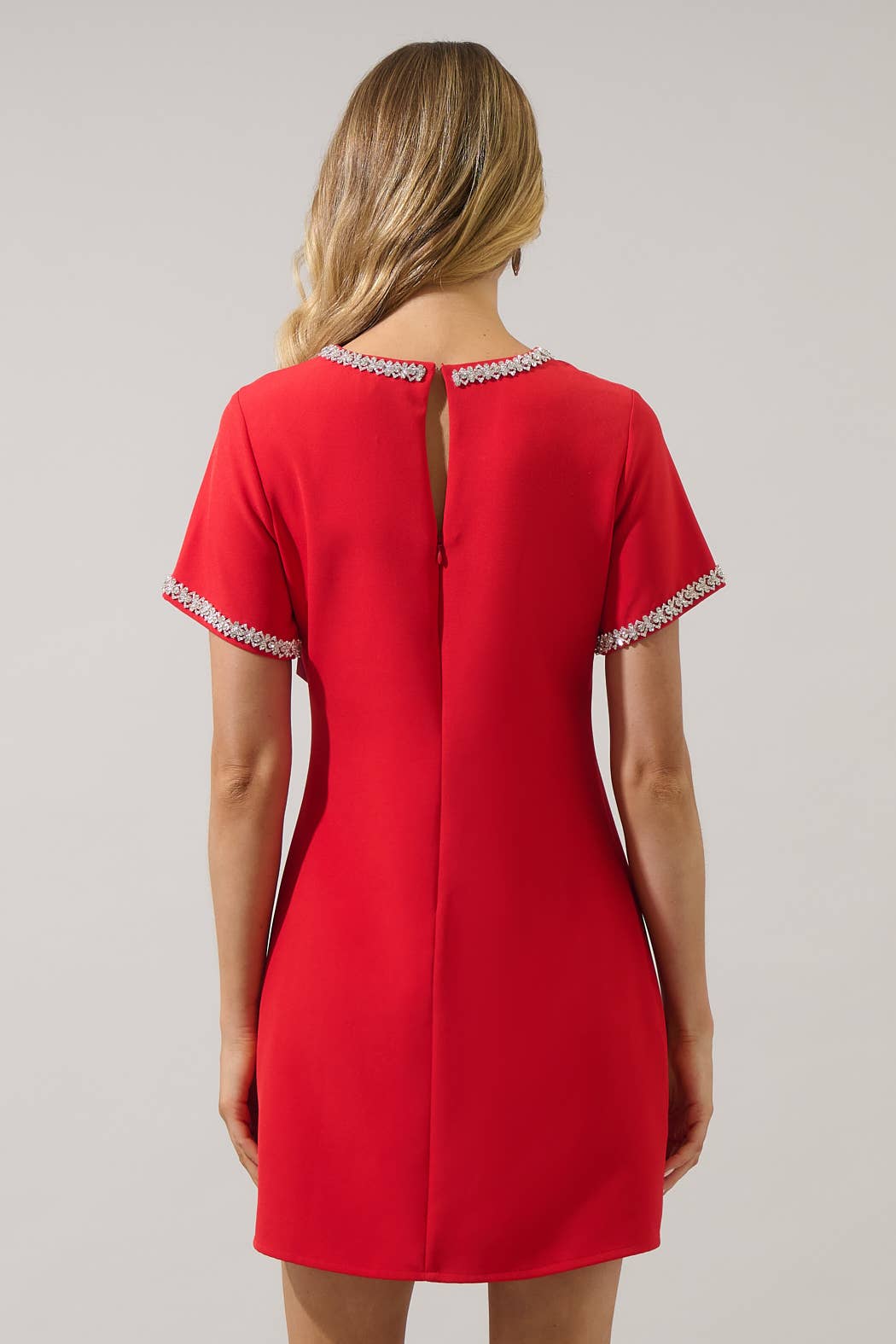 Sugarlips Kaitlyn Rhinestone Shift Mini Dress in red, featuring a sleeveless design with sparkling rhinestone embellishments.