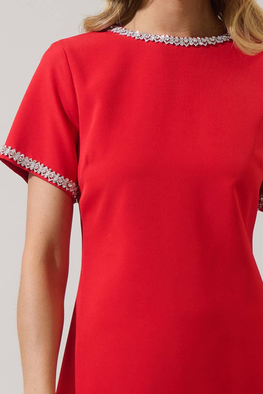 Red Kaitlyn Rhinestone Shift Mini Dress by Sugarlips featuring sparkling rhinestone details and a sleek, fitted silhouette.