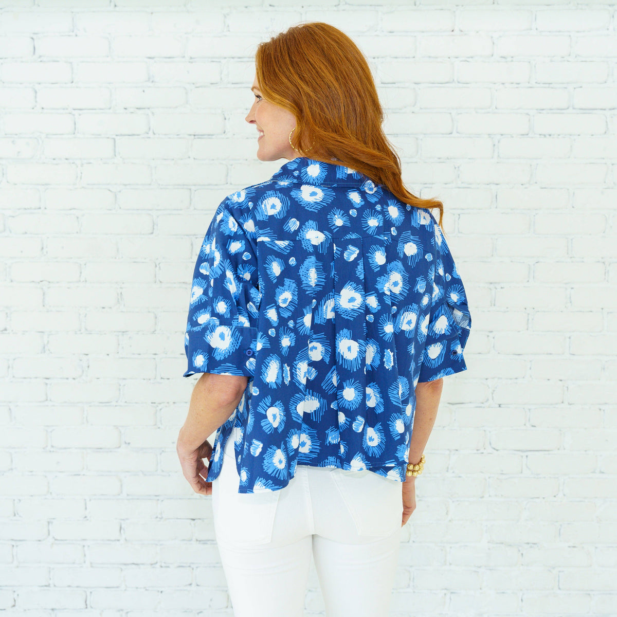 Navy Abby Burst Print Blouse by Caryn Lawn, stylish top with vibrant burst print design, lightweight fabric, and relaxed fit.