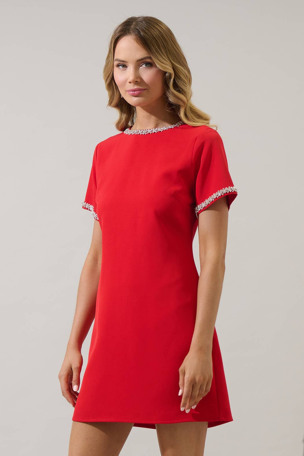 Red Kaitlyn Rhinestone Shift Mini Dress by Sugarlips featuring sparkling rhinestones and a stylish, modern silhouette.