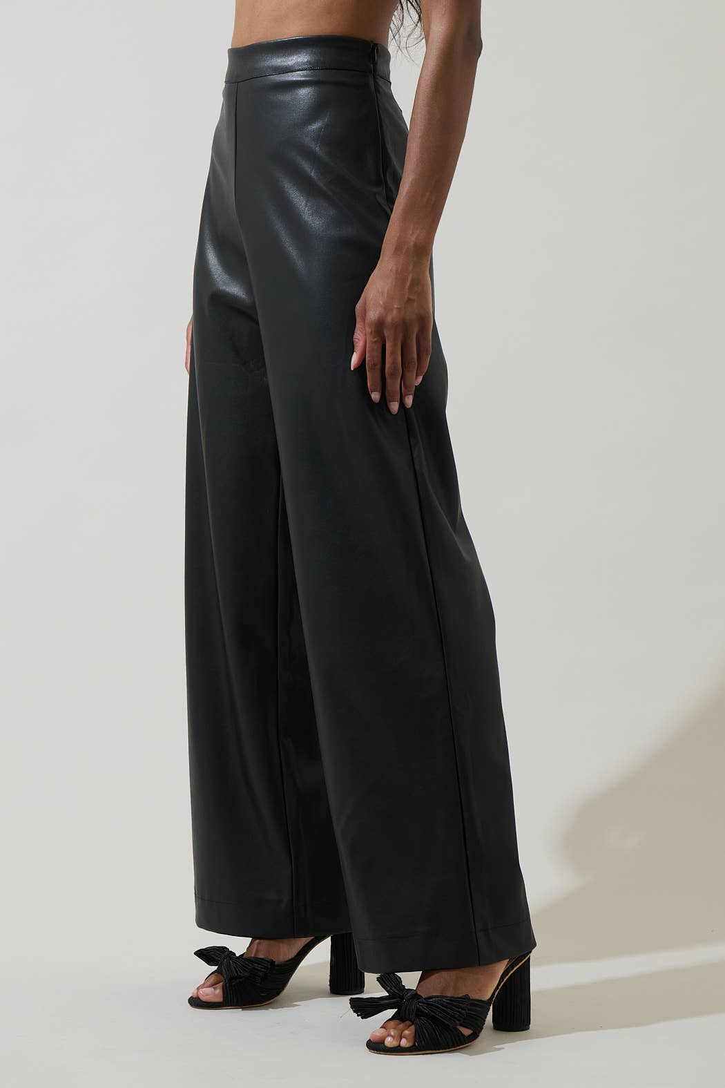 Black Anisa Leather Bern Wide-Leg Pants by Sugarlips, stylish bottoms with a wide-leg silhouette and leather texture.