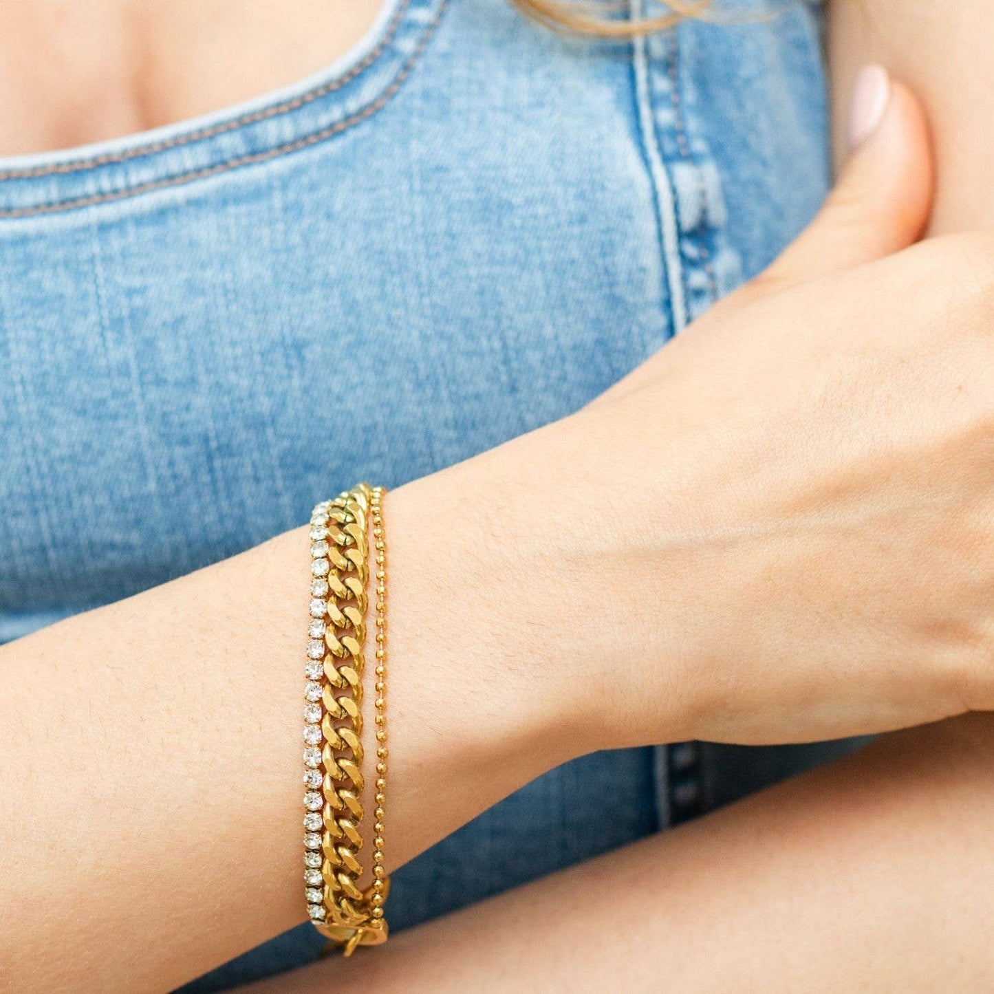 Gold water-resistant statement bracelet from Splendid Iris with bold jewelry design and intricate detailing