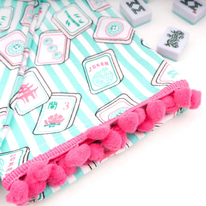Set of Mahjong Stripe Pom-Pom kitchen towels by 8 Oak Lane featuring colorful striped patterns and playful pom-pom accents.