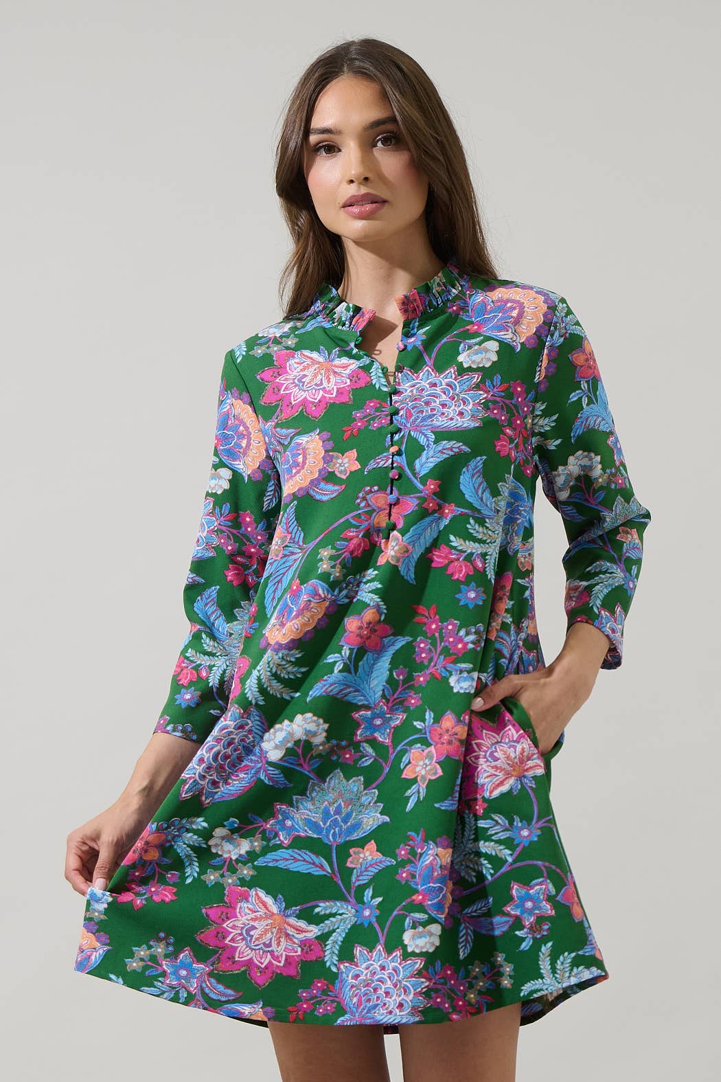 Sugarlips Elara Emerald Ruelle Mini Dress with floral details, fitted silhouette, and sleeveless design perfect for summer events.