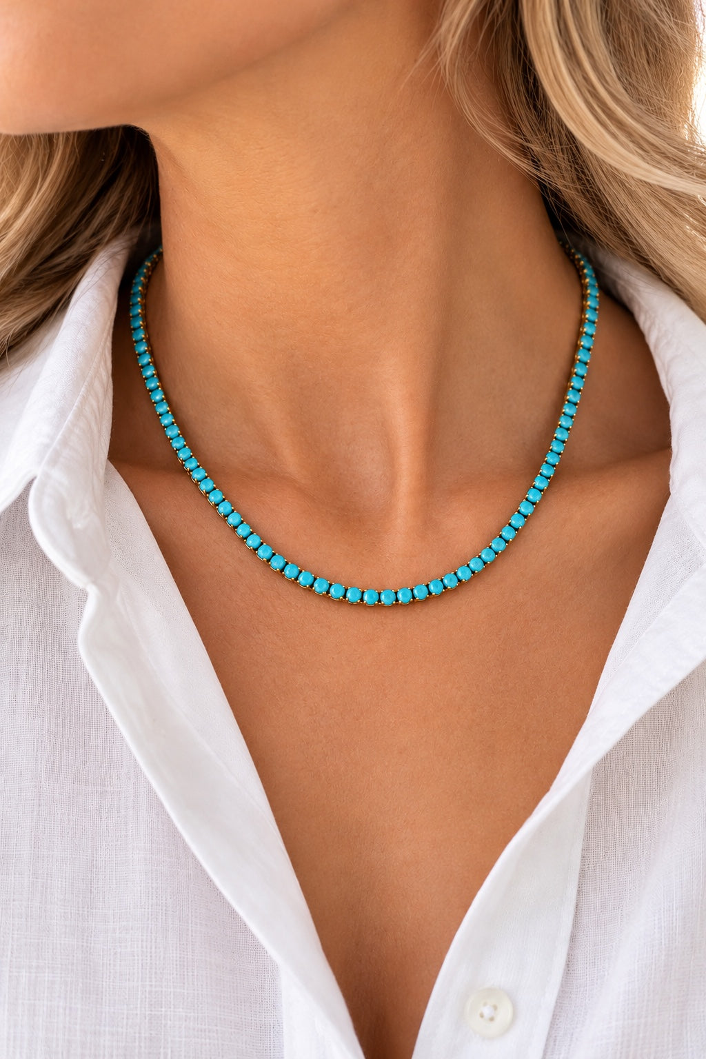 Turquoise tennis necklace worn with white linen