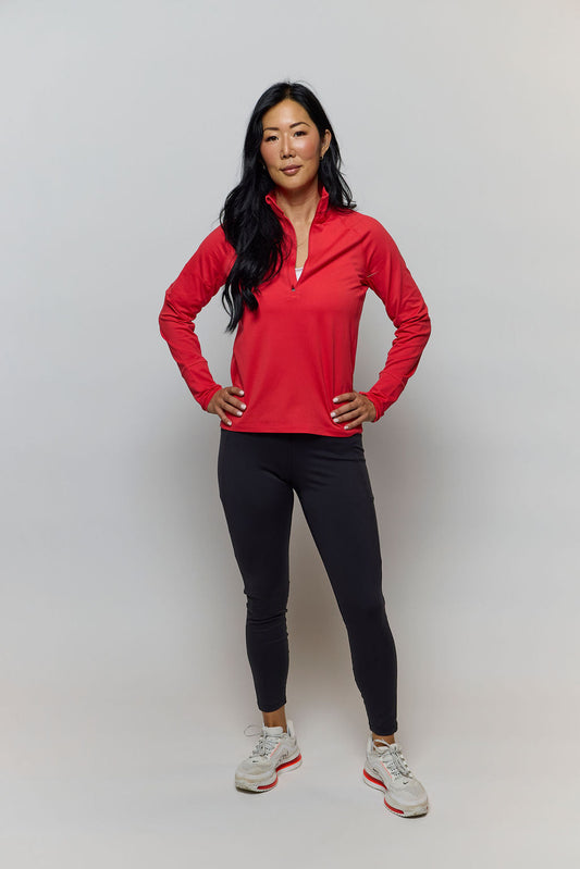 Goal Five Foudy mid-weight long sleeve training top with ½ zip, shown in a casual studio setting.