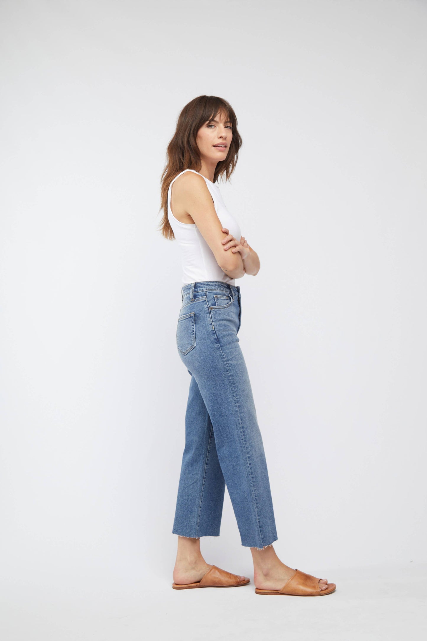 Oliver Logan Aberdeen Ankle Crop High Rise Jean in standard wash, showcasing fitted denim bottoms with cropped ankle length.