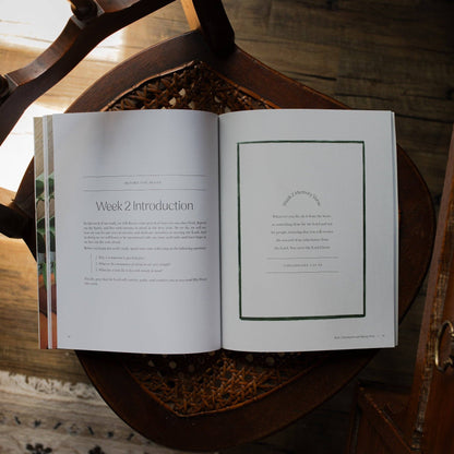 Open copy of The Daily Grace Co Fresh Start Devotional with colorful cover and pages visible.