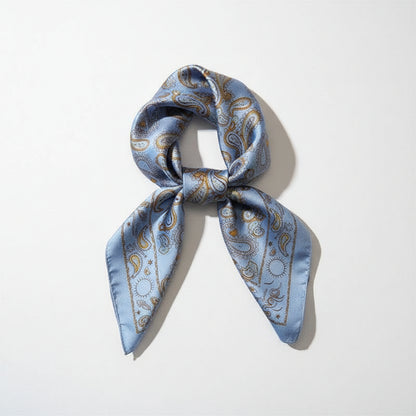 Capri Blue silk square scarf with floral pattern, featuring vibrant blue and white colors, suitable for fashion accessories