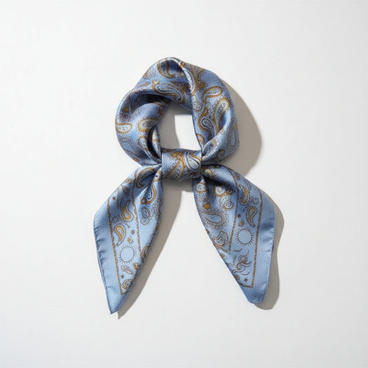 Capri Blue silk square scarf with floral pattern, featuring vibrant blue and white colors, suitable for fashion accessories