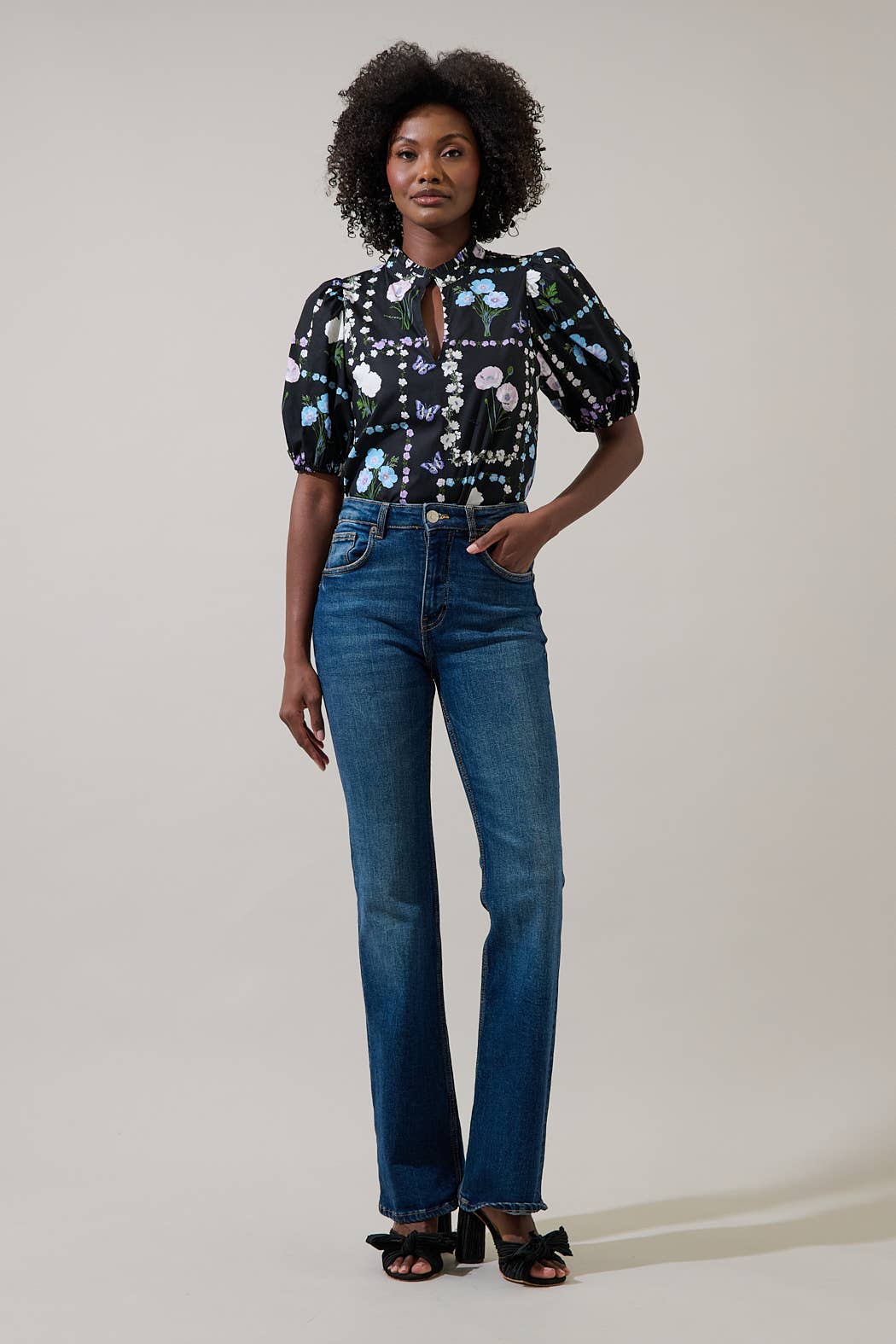 Sugarlips Trevis Noir Garden Blouse, a stylish black top with floral detailing, displayed on a mannequin.