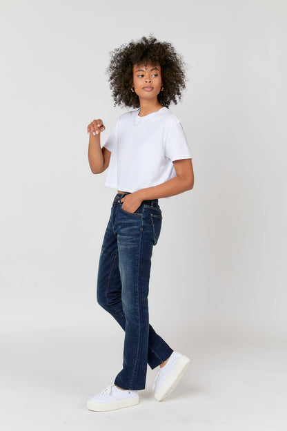 Oliver Logan Crosby Mid Rise Relaxed Taper Jean in standard wash, showing the relaxed fit and classic denim texture.