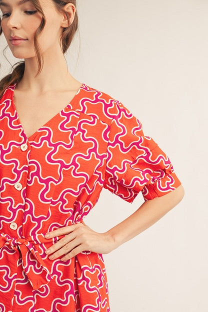 Jodiful Sienna Sunset abstract midi dress with flowing fabric and vibrant sunset-inspired pattern, perfect for stylish occasions.