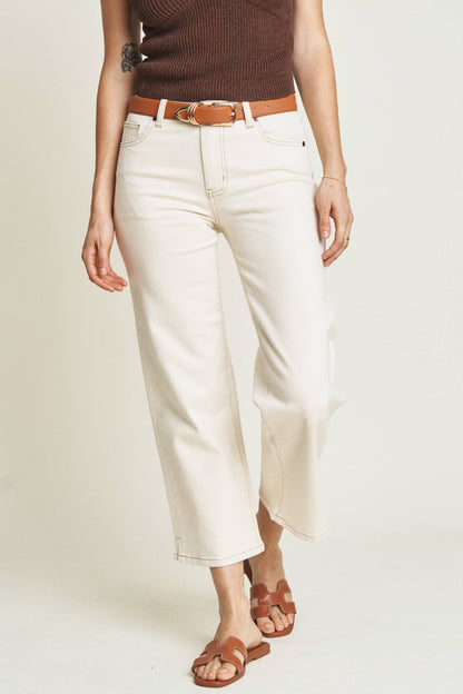 Oliver Logan Addington ankle crop mid-rise jeans in ecru, showcasing the stylish light-colored denim bottoms with a cropped fit.