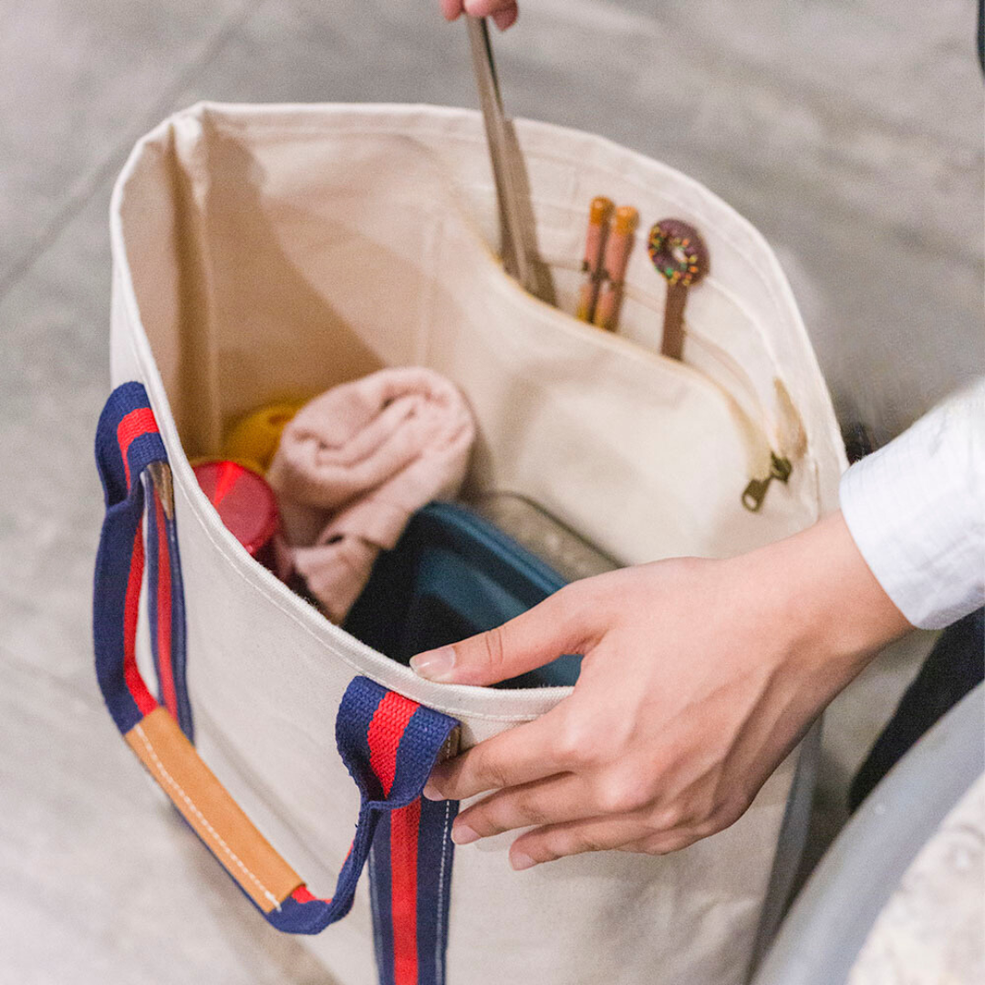 ShoreBags Society Canvas Leather Tote bag with sturdy handles and spacious interior, designed for stylish everyday use.