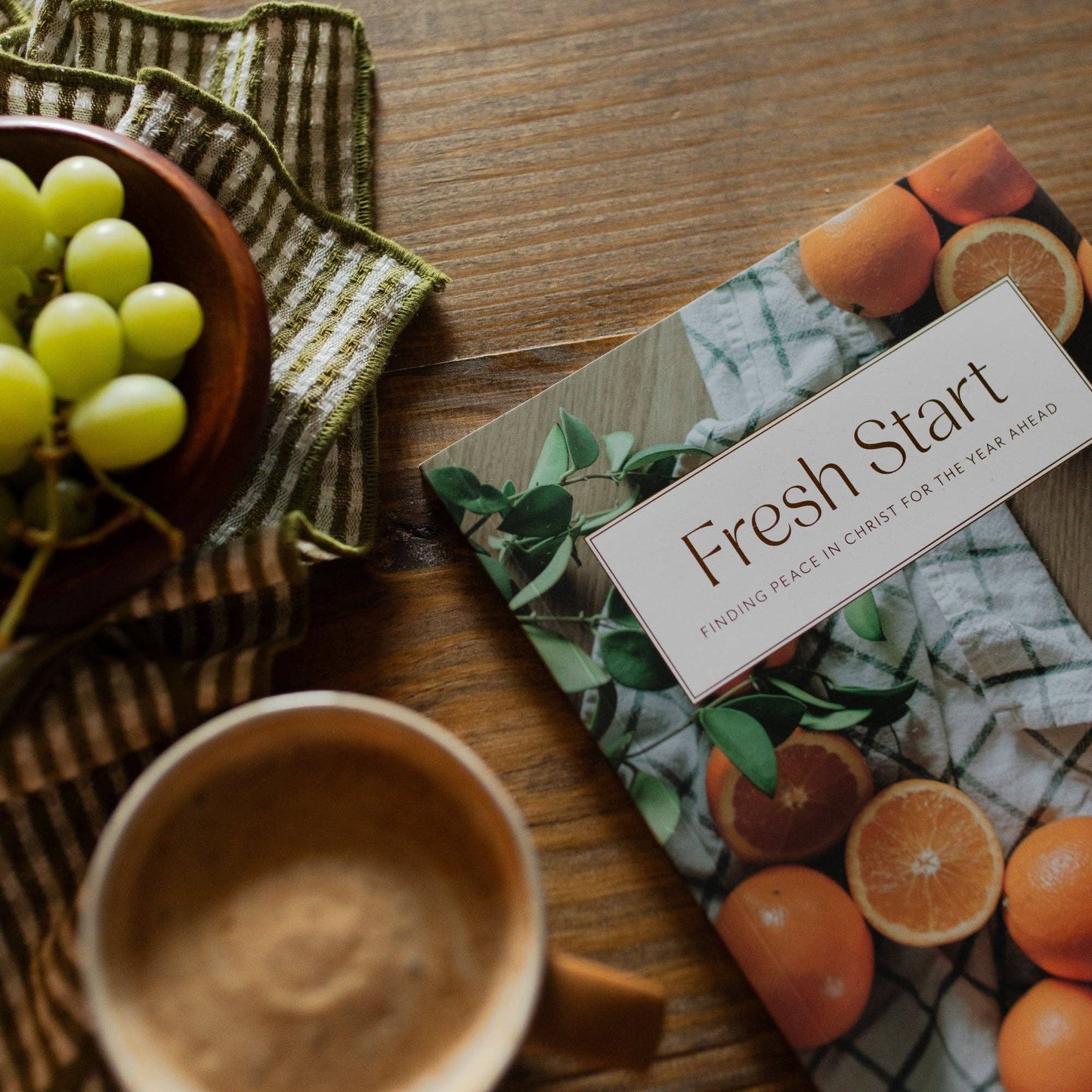 Fresh Start Devotional by The Daily Grace Co, open book with pages featuring inspiring devotional content and calming design.