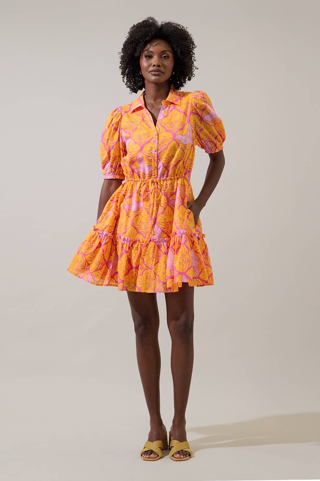 Sugarlips Jaidy Stacie button-down mini dress in floral print, featuring a collared neckline and long sleeves.