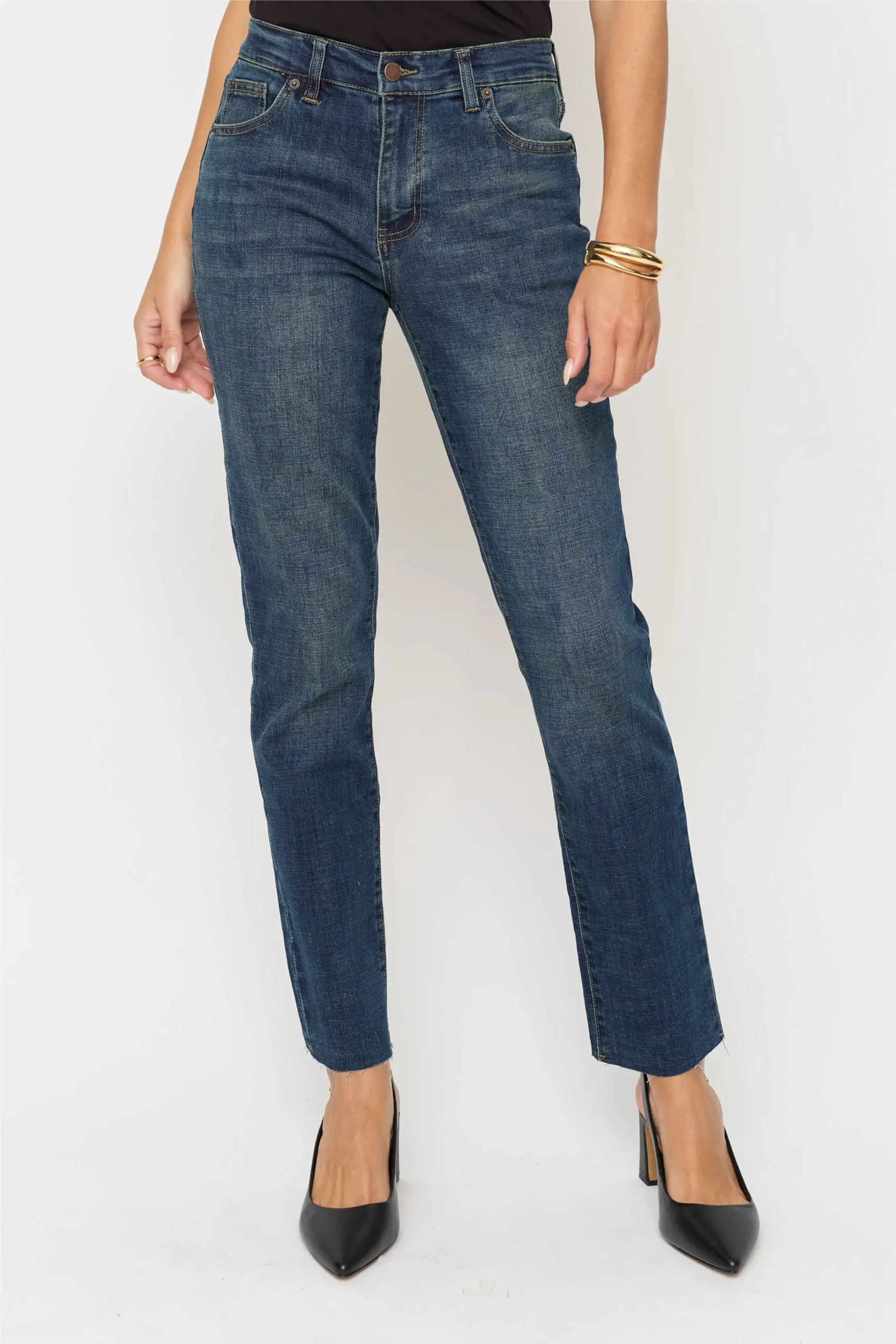 Oliver Logan Crosby Mid Rise Relaxed Taper Jean in standard wash, showing the denim bottoms with relaxed fit and tapered leg.