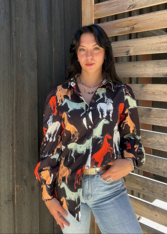 Black horse print blouse by Lil Bee's Bohemian featuring a stylish off-to-the-races design and lightweight fabric.
