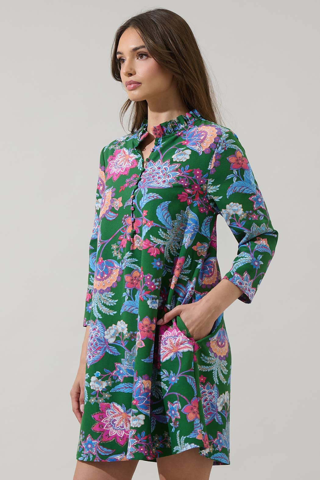 Sugarlips Elara Emerald Ruelle Mini Dress, vibrant green dress with ruffled details, sleeveless design, perfect for stylish occasions.