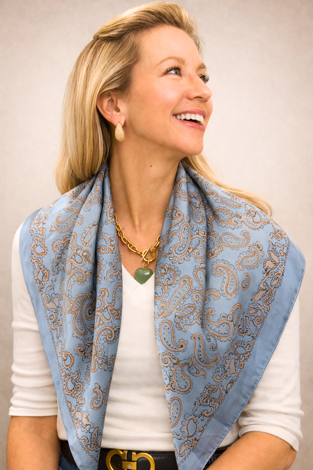 Silk square scarf featuring vibrant patterns, designed by Capri Blue, perfect for stylish accessorizing and versatile fashion.