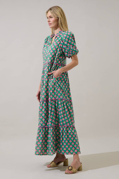 Sugarlips Gercy Renley tiered maxi dress with flowing fabric, sleeveless design, and floral pattern perfect for summer wear.