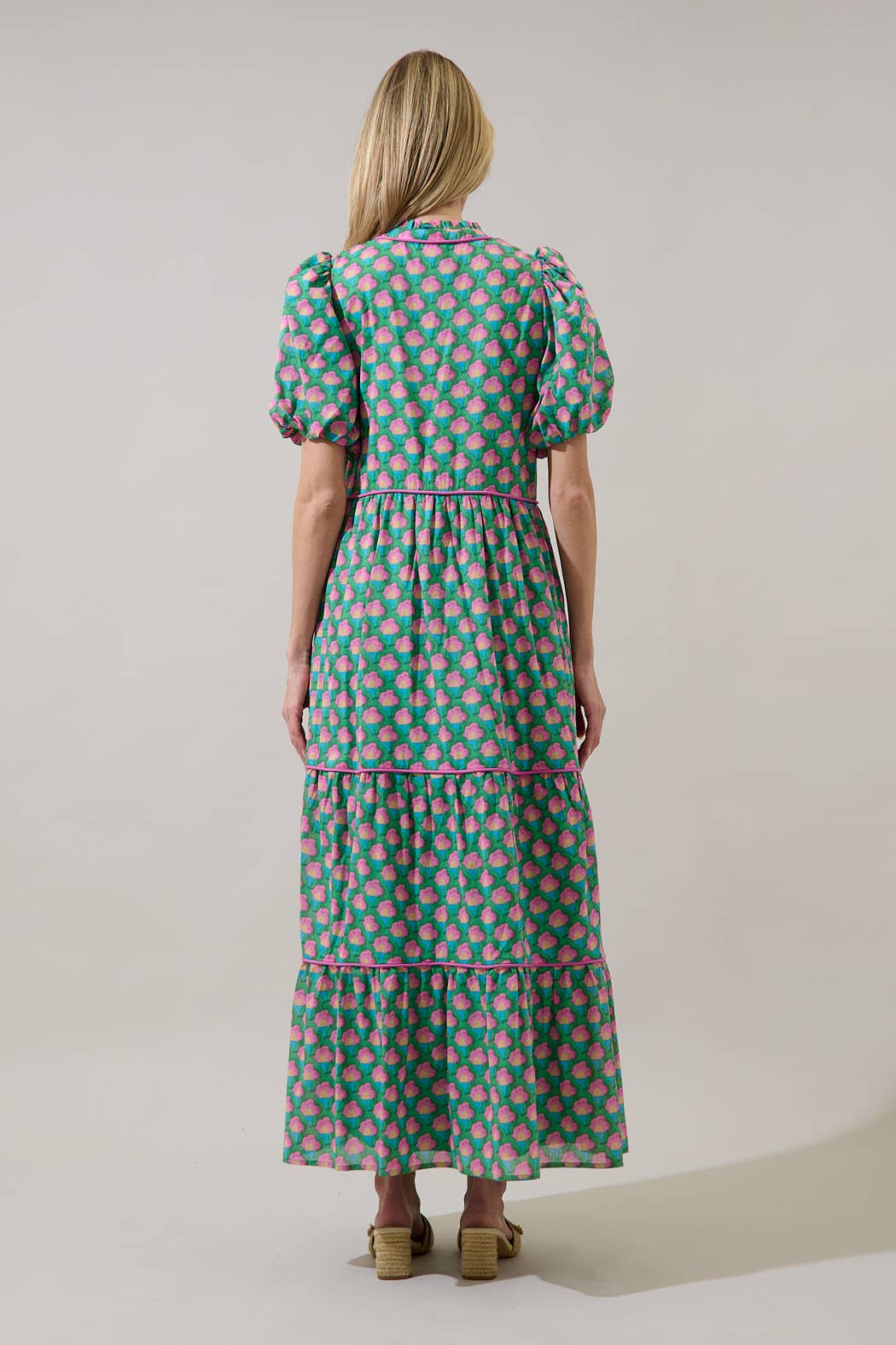 Sugarlips Gercy Renley tiered maxi dress with flowy fabric and layered design, shown on a model.