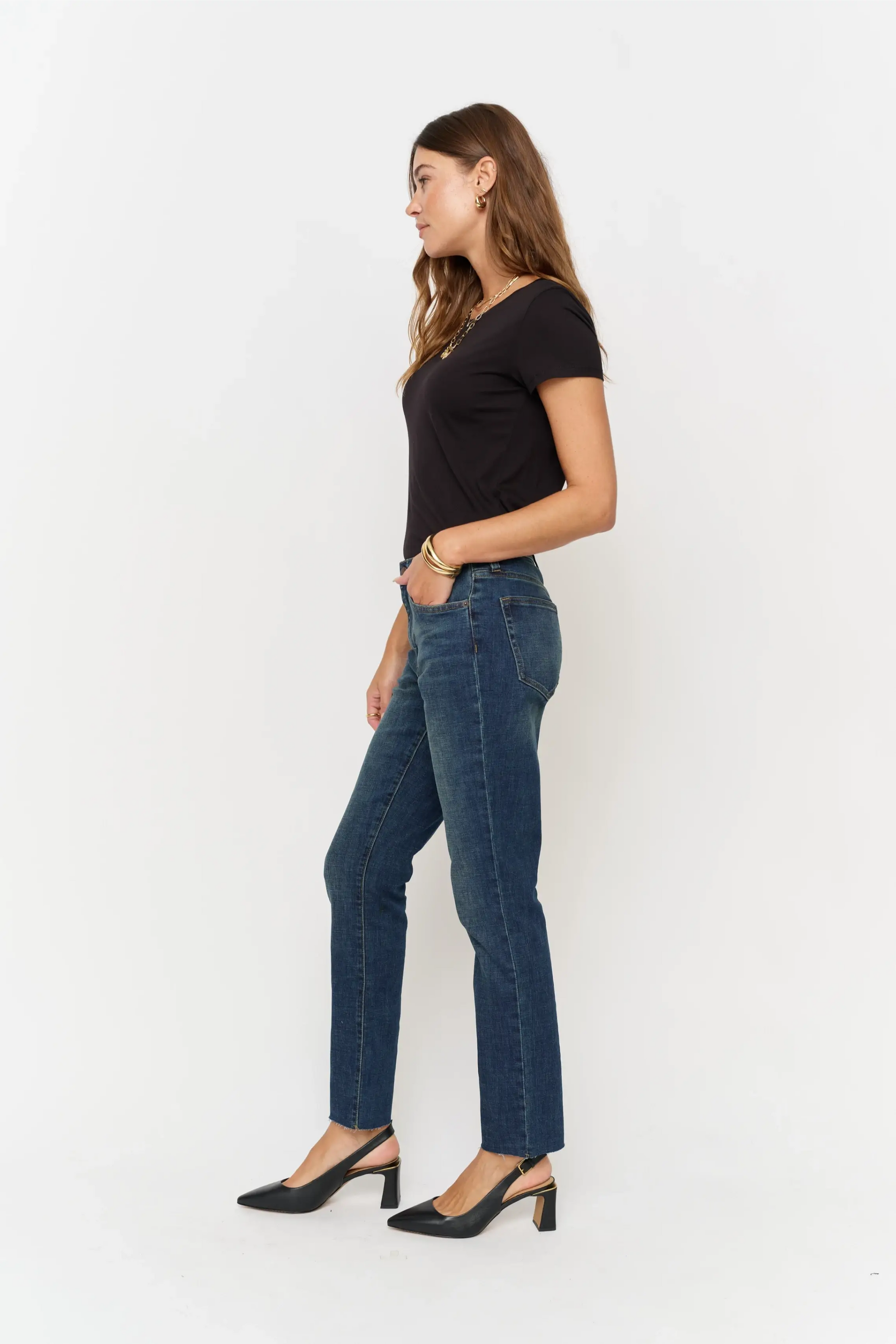 Oliver Logan Crosby Mid Rise Relaxed Taper Jean in standard wash, showcasing classic denim bottoms with a relaxed fit.