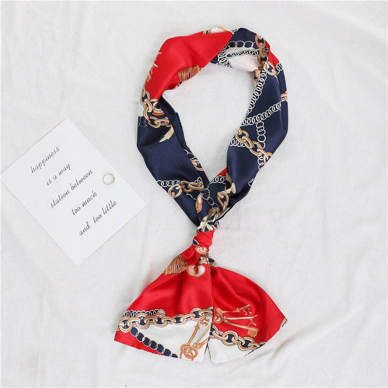 Double-sided narrow long silk scarf by UZ Wholesale Store, showcasing its smooth, shiny fabric and elegant drape.