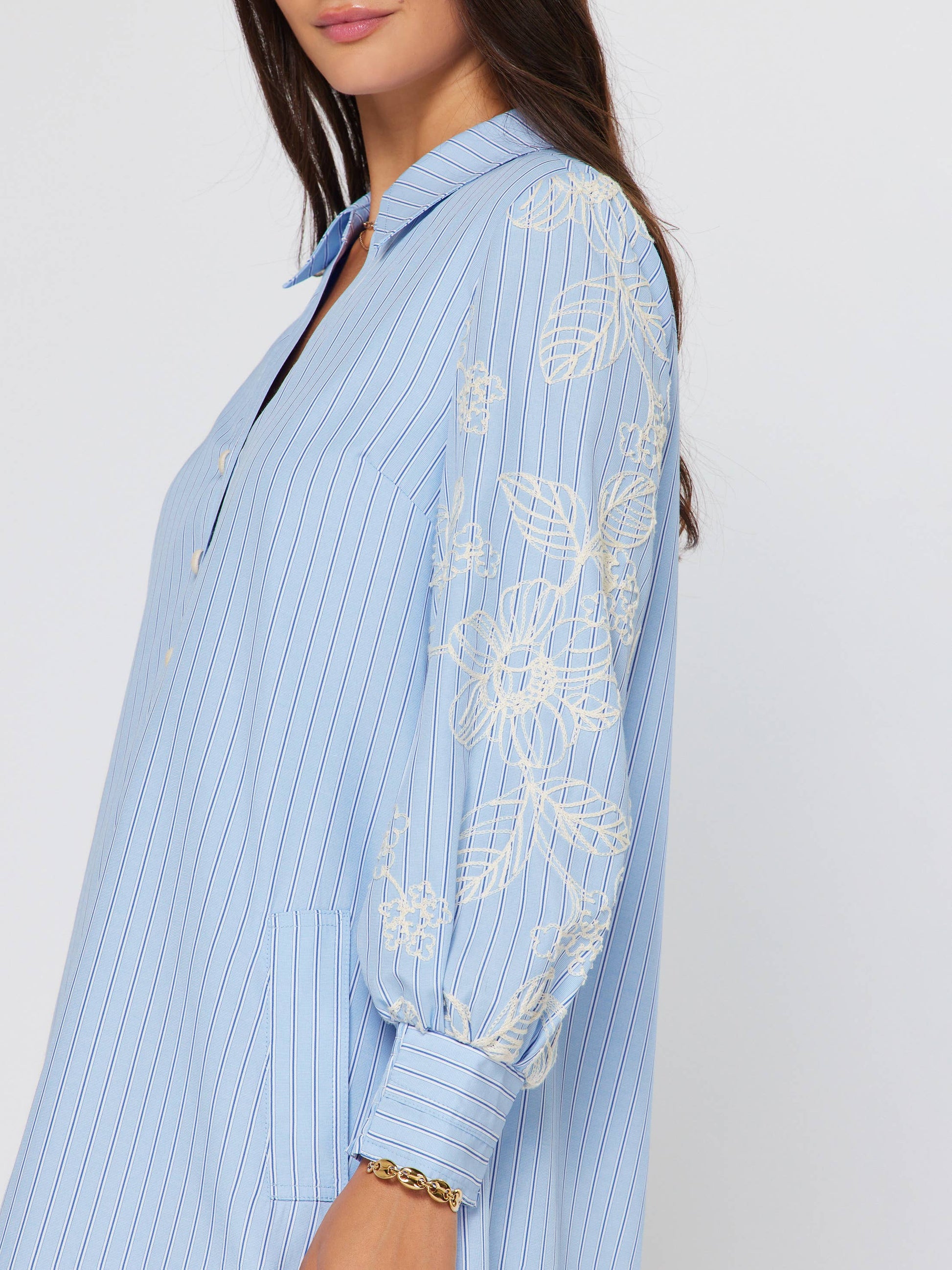 Current Air Eloise Embroidered Misty Blue Dress with floral embroidery and flowing fabric, front view showing elegant design.