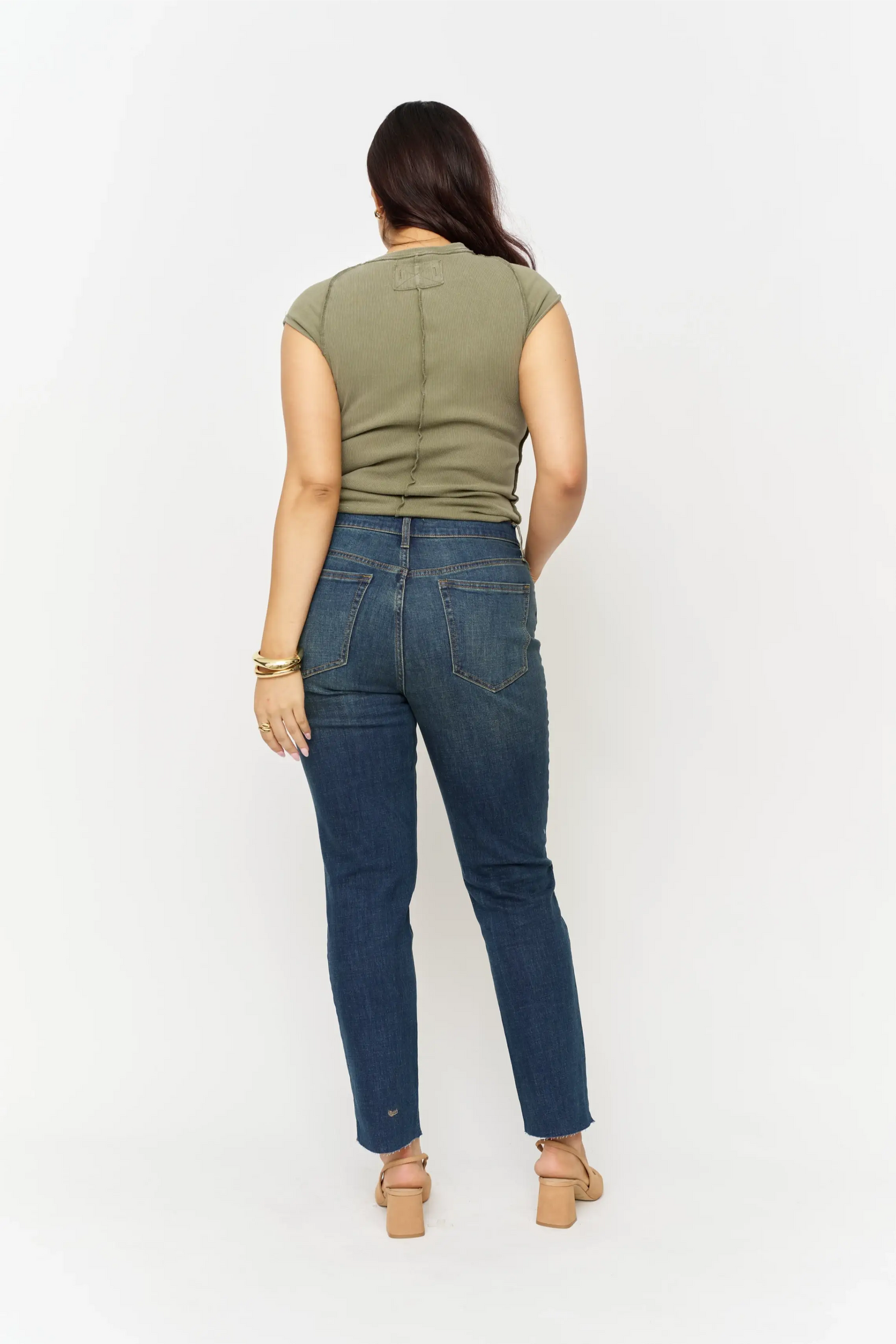Oliver Logan Crosby Mid Rise Relaxed Taper Jean in standard wash, showcasing the denim's fit and relaxed style.