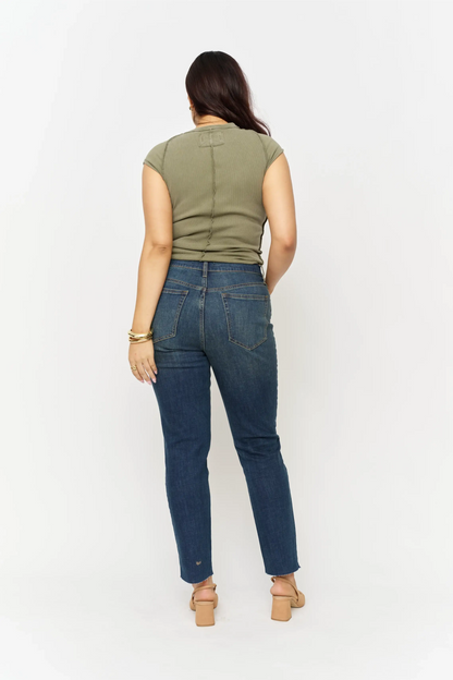Oliver Logan Crosby Mid Rise Relaxed Taper Jean in standard wash, showcasing the denim's fit and relaxed style.