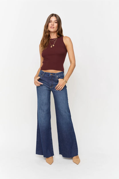 Oliver Logan Crawford mid-rise fitted wide-leg jeans in dark worn denim, showing the relaxed fit and stylish design.