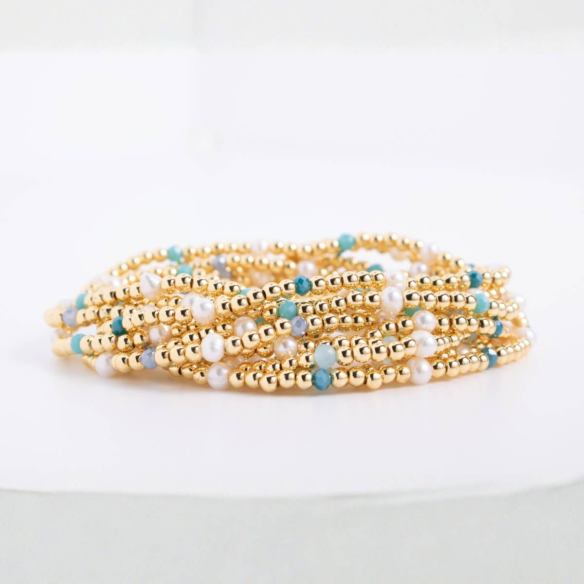 Splendid Iris Carolina Pearl Stack Bracelet with multiple pearl strands and silver accents, elegant jewelry accessory.