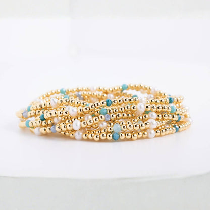 Splendid Iris Carolina Pearl Stack Bracelet with multiple pearl strands and silver accents, elegant jewelry accessory.