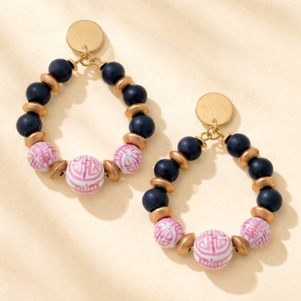 Beaded hoop earrings with porcelain details featuring chinoiserie and painted wood accents, designed by Canvas Style.