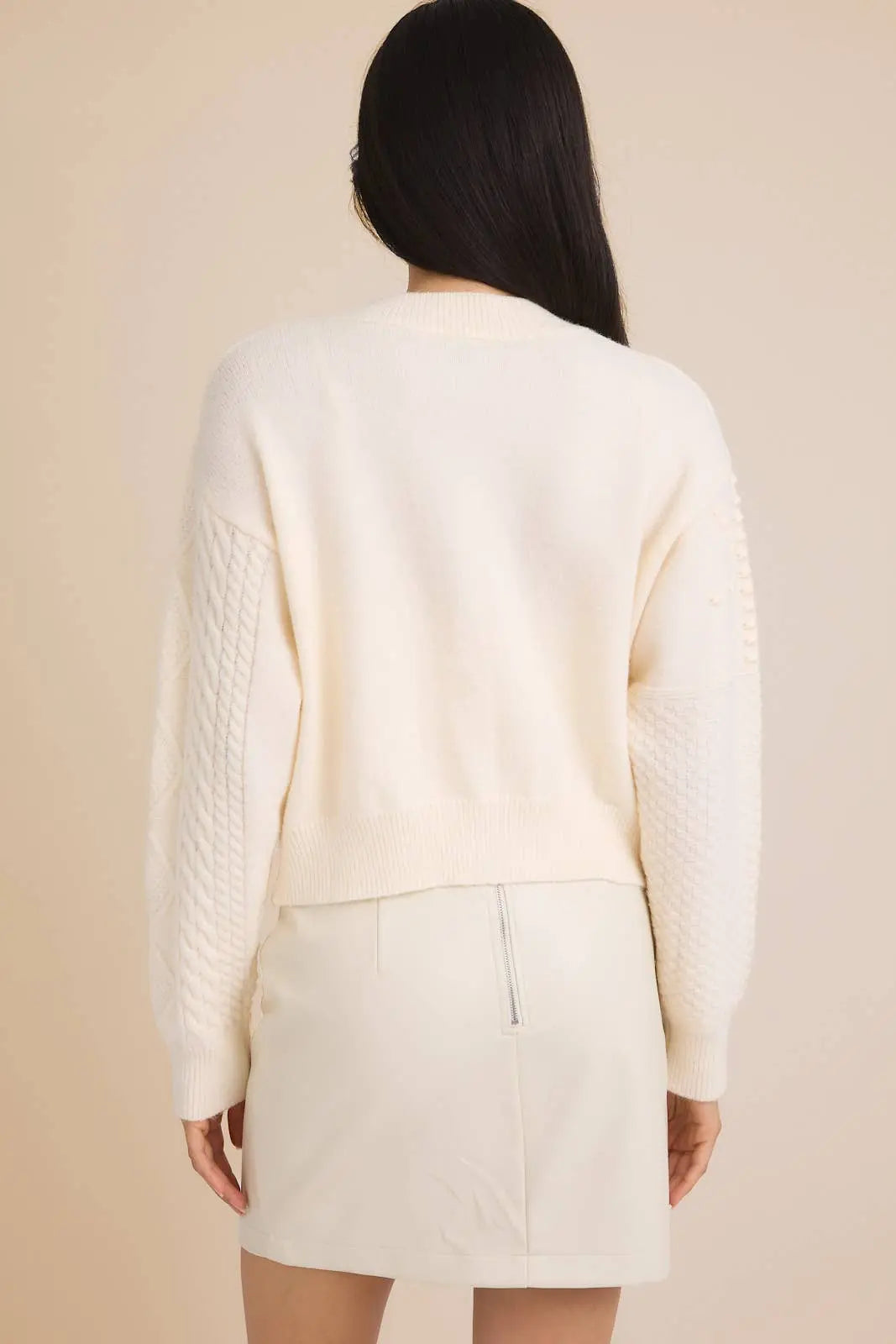 GILLI Camille cable knit cardigan sweater with button closure, soft textured fabric, and long sleeves.