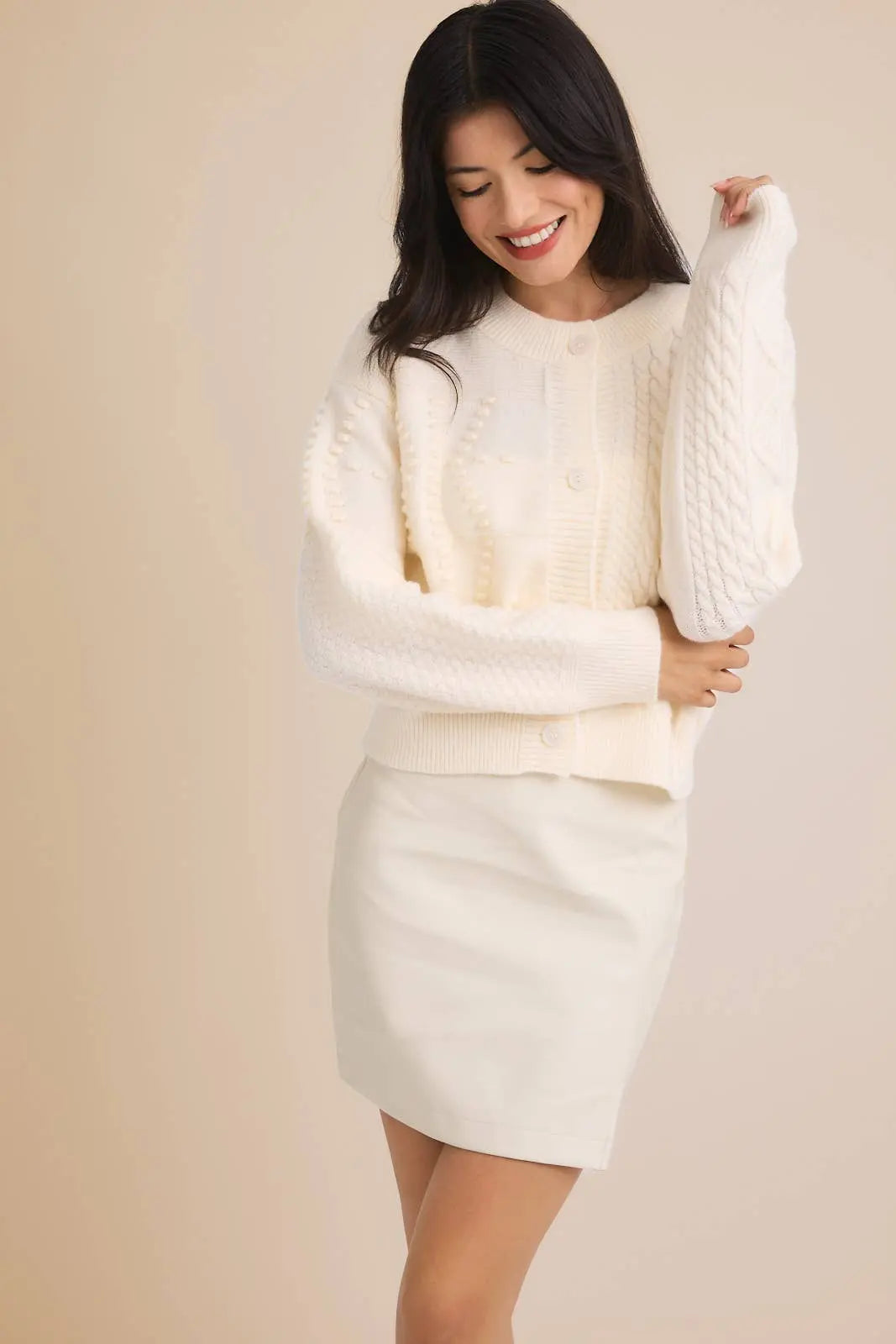 GILLI Camille cable knit cardigan sweater in soft yarn, featuring a cozy, textured design with front buttons and ribbed cuffs.